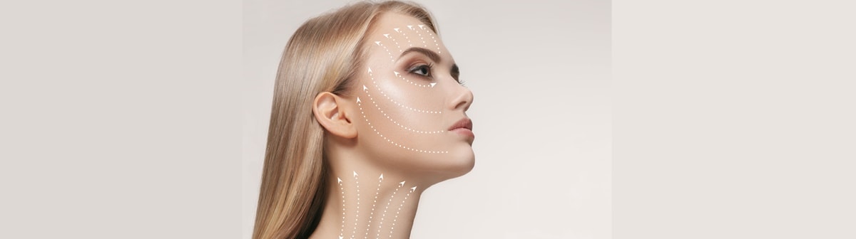 Mulher jovem tem ilustrações de flechas em seu rosto representando a modelagem